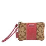 Pre-owned Canvas clutches Coach Pre-owned , Beige , Dames