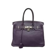 Pre-owned Leather handbags Hermès Vintage , Purple , Dames