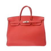 Pre-owned Leather handbags Hermès Vintage , Orange , Dames