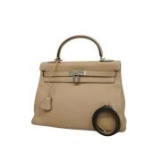 Pre-owned Leather handbags Hermès Vintage , Beige , Dames