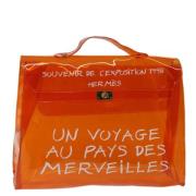 Pre-owned Vinyl handbags Hermès Vintage , Orange , Dames