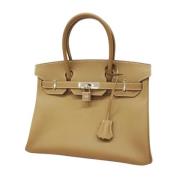 Pre-owned Leather handbags Hermès Vintage , Beige , Dames