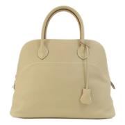 Pre-owned Leather handbags Hermès Vintage , Beige , Dames