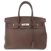 Pre-owned Fabric handbags Hermès Vintage , Brown , Dames