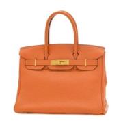 Pre-owned Fabric handbags Hermès Vintage , Orange , Dames