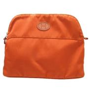 Pre-owned Leather pouches Hermès Vintage , Orange , Dames