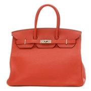 Pre-owned Leather handbags Hermès Vintage , Orange , Dames