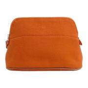 Pre-owned Canvas pouches Hermès Vintage , Orange , Dames