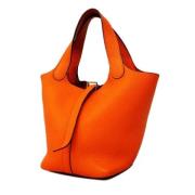 Pre-owned Leather handbags Hermès Vintage , Orange , Dames