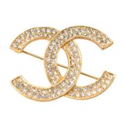 Pre-owned Metal brooches Chanel Vintage , Yellow , Dames