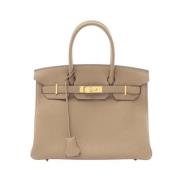 Pre-owned Leather handbags Hermès Vintage , Beige , Dames