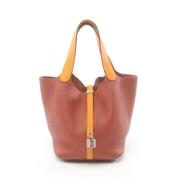 Pre-owned Leather handbags Hermès Vintage , Orange , Dames