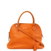 Pre-owned Canvas handbags Hermès Vintage , Orange , Dames