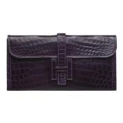 Pre-owned Leather clutches Hermès Vintage , Purple , Dames