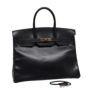 Pre-owned Leather handbags Hermès Vintage , Black , Dames