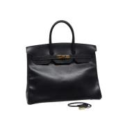 Pre-owned Leather handbags Hermès Vintage , Black , Dames