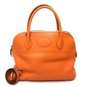 Pre-owned Leather handbags Hermès Vintage , Orange , Dames