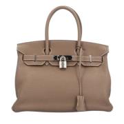 Pre-owned Leather handbags Hermès Vintage , Brown , Dames