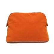 Pre-owned Leather pouches Hermès Vintage , Orange , Dames