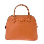 Pre-owned Leather handbags Hermès Vintage , Orange , Dames