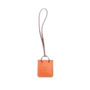 Pre-owned Leather key-holders Hermès Vintage , Orange , Dames