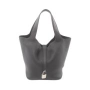 Pre-owned Leather handbags Hermès Vintage , Black , Dames