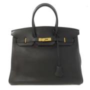 Pre-owned Fabric handbags Hermès Vintage , Black , Dames