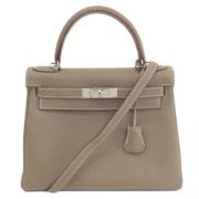 Pre-owned Leather handbags Hermès Vintage , Beige , Dames