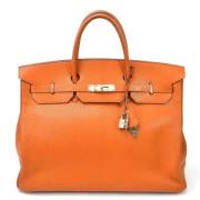 Pre-owned Leather handbags Hermès Vintage , Orange , Dames