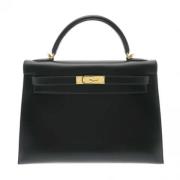 Pre-owned Leather handbags Hermès Vintage , Black , Dames