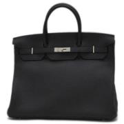 Pre-owned Leather handbags Hermès Vintage , Black , Dames