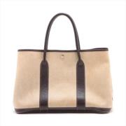 Pre-owned Canvas handbags Hermès Vintage , Beige , Heren