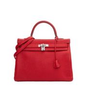 Pre-owned Leather handbags Hermès Vintage , Red , Dames