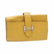 Pre-owned Leather key-holders Hermès Vintage , Yellow , Dames