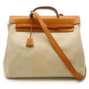 Pre-owned Canvas handbags Hermès Vintage , Beige , Dames