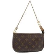 Pre-owned Canvas pouches Louis Vuitton Vintage , Brown , Dames