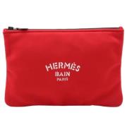 Pre-owned Canvas clutches Hermès Vintage , Red , Dames