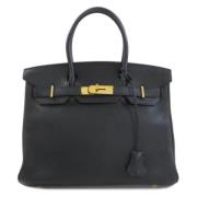 Pre-owned Leather handbags Hermès Vintage , Black , Dames