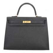 Pre-owned Leather handbags Hermès Vintage , Black , Dames