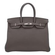 Pre-owned Leather handbags Hermès Vintage , Gray , Dames