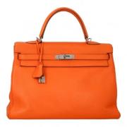 Pre-owned Leather handbags Hermès Vintage , Orange , Dames