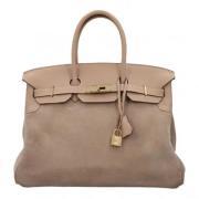 Pre-owned Leather handbags Hermès Vintage , Beige , Dames