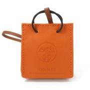 Pre-owned Leather key-holders Hermès Vintage , Orange , Dames