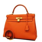 Pre-owned Leather handbags Hermès Vintage , Orange , Dames