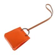 Pre-owned Leather key-holders Hermès Vintage , Orange , Dames