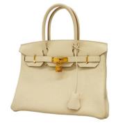 Pre-owned Leather handbags Hermès Vintage , Beige , Dames