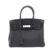 Pre-owned Leather handbags Hermès Vintage , Black , Dames