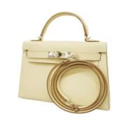 Pre-owned Leather handbags Hermès Vintage , Beige , Dames