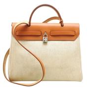 Pre-owned Canvas handbags Hermès Vintage , Beige , Dames