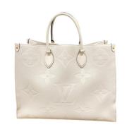 Pre-owned Canvas handbags Louis Vuitton Vintage , Beige , Dames